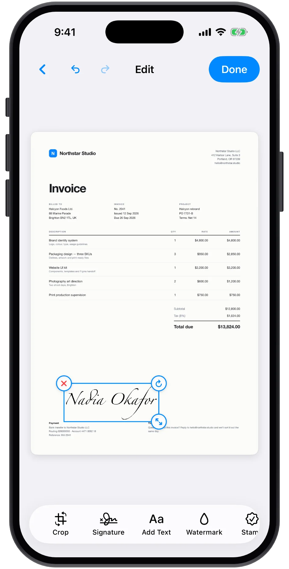 A signature placed on a scanned invoice in the editor